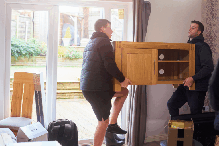two men removing a desk from redmond home