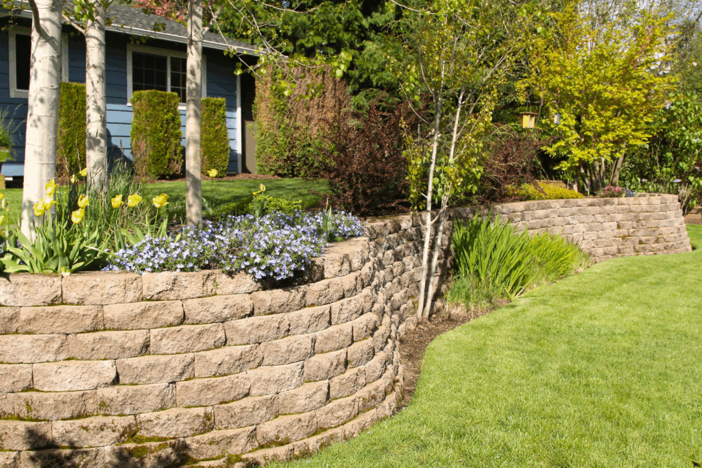 retaining wall along yard with flowers